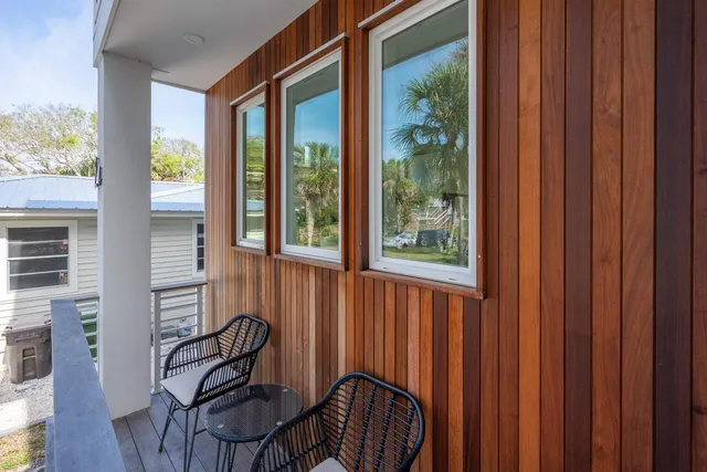 a view of a door and chair in the balcony