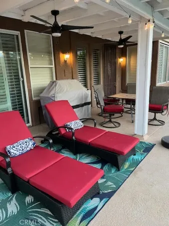 a view of a balcony with table and chairs