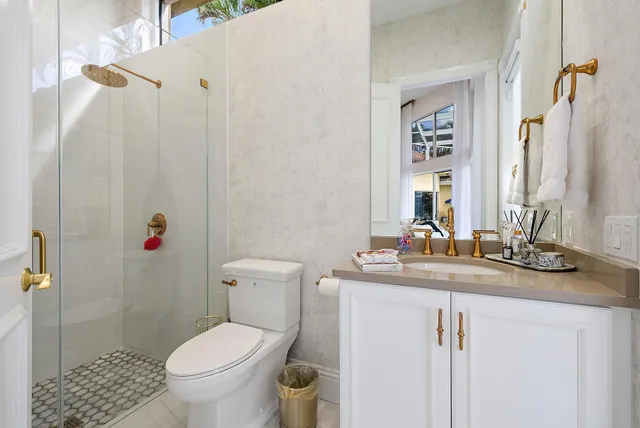 a living room with furniture a chandelier and a large window