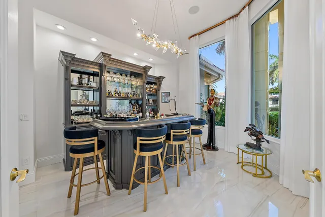 a living room with furniture a rug and a chandelier