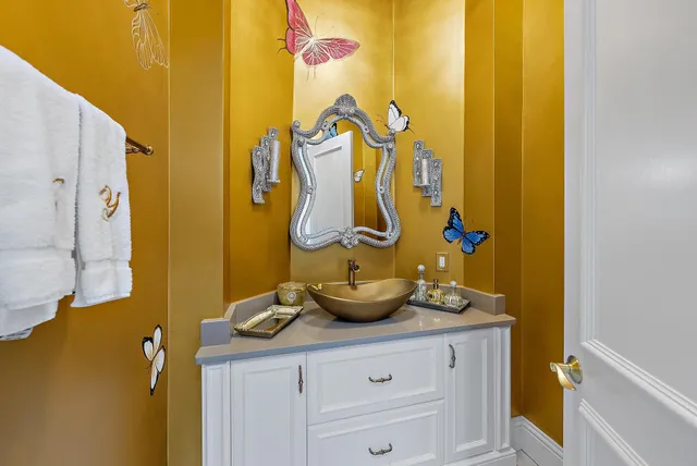 a view of walk in closet with clothes