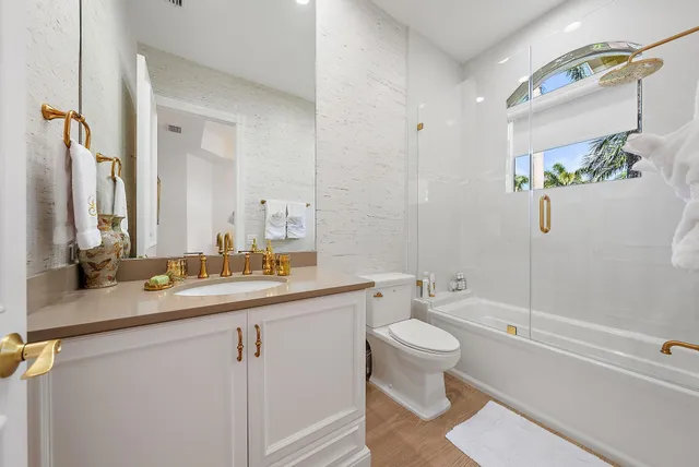 a bath tub sitting in a bathroom next to a window