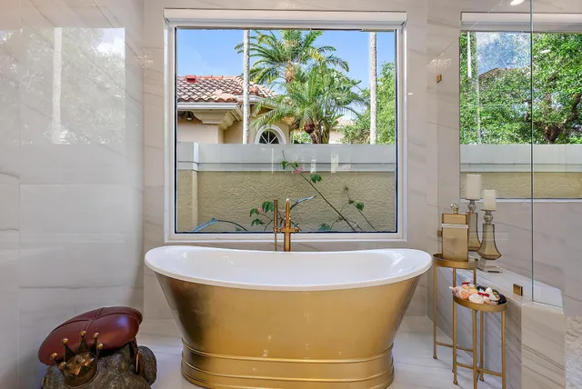 a living room with furniture a rug and a piano