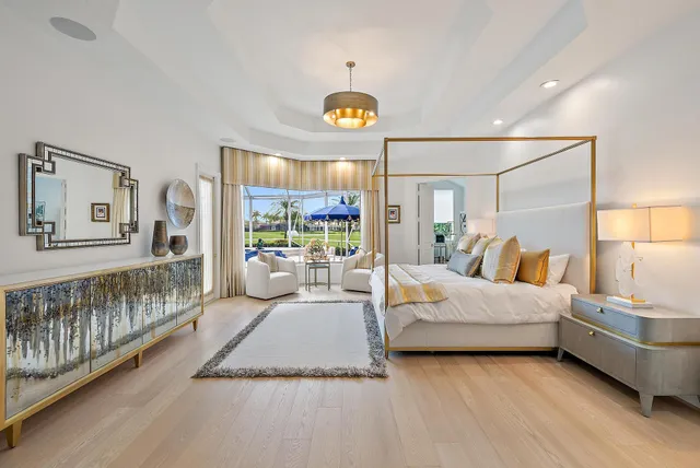 a kitchen with stainless steel appliances a white cabinets a sink and wooden floor