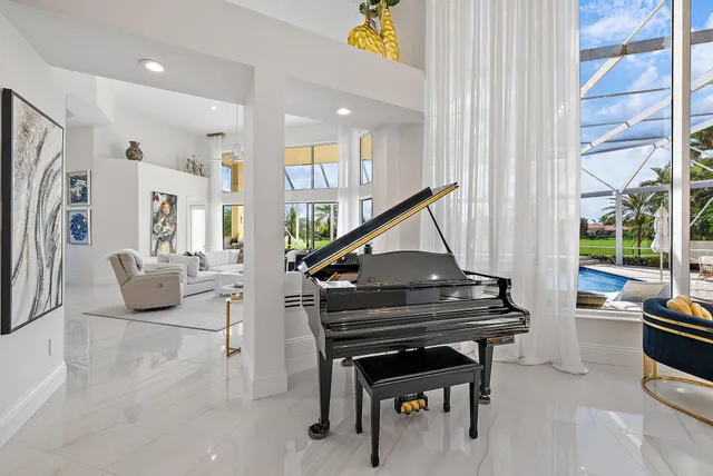 a bedroom with two beds and a large window