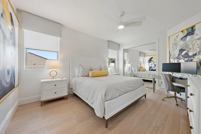 a view of a swimming pool with an outdoor seating