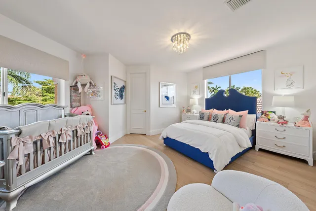 a view of a house with a yard and a garden