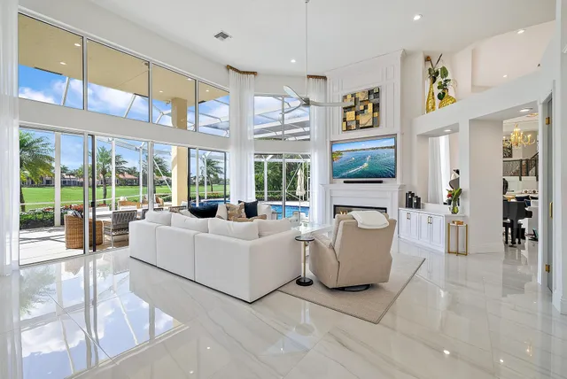 a living room with furniture and a mirror