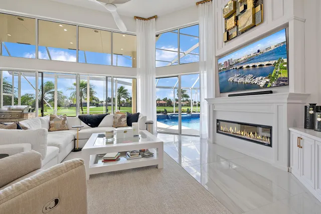 a front view of a house with swimming pool and porch