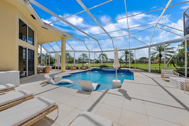 a living room with lots of furniture and a chandelier