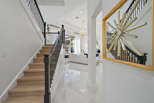 a living room with furniture chandelier and a chandelier