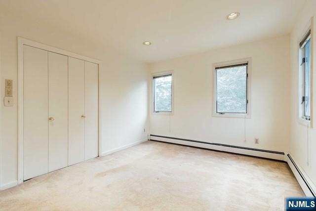 212 Filippe Court Paramus, NJ 07652 - Photo 13 of 16 an empty room with windows