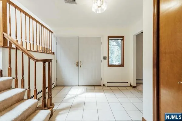 a view of a livingroom with a dinning table and chair