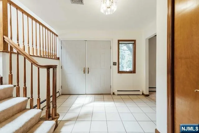 a view of a livingroom with a dinning table and chair
