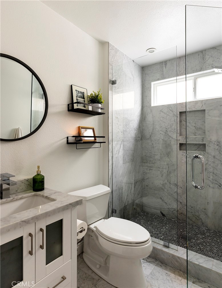 27871 Country Lane Road Laguna Niguel, CA 92677 - Photo 13 of 35 a bathroom with a sink a toilet and a mirror