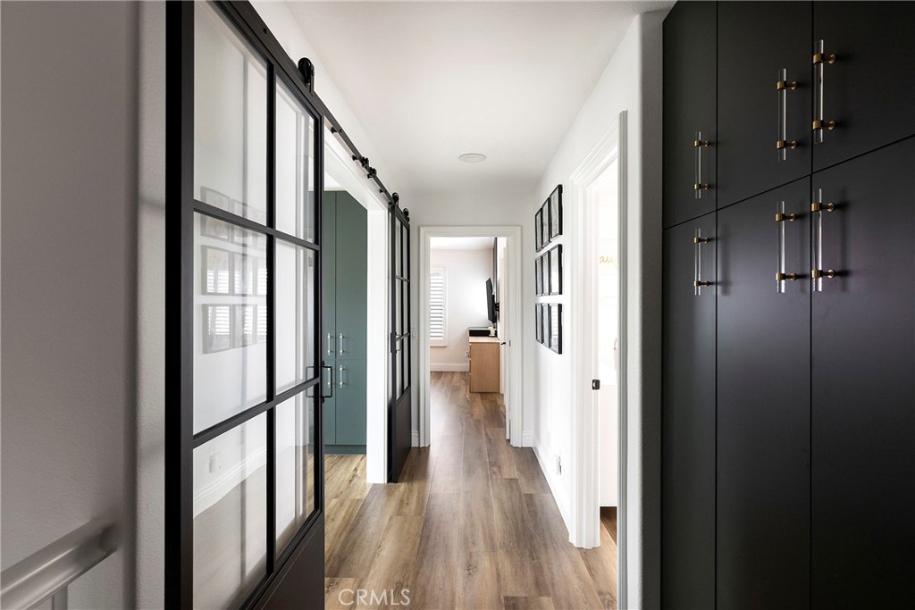 27871 Country Lane Road Laguna Niguel, CA 92677 - Photo 17 of 35 a view of a hallway with wooden floor and staircase