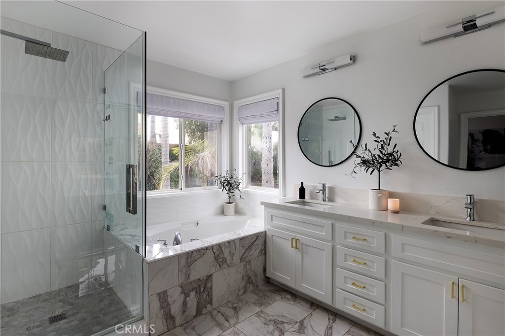 27871 Country Lane Road Laguna Niguel, CA 92677 - Photo 19 of 35 a bathroom with a double vanity sink mirror and bathtub