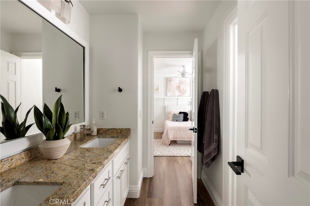 27871 Country Lane Road Laguna Niguel, CA 92677 - Photo 24 of 35 a bathroom with a granite countertop sink a mirror and shower
