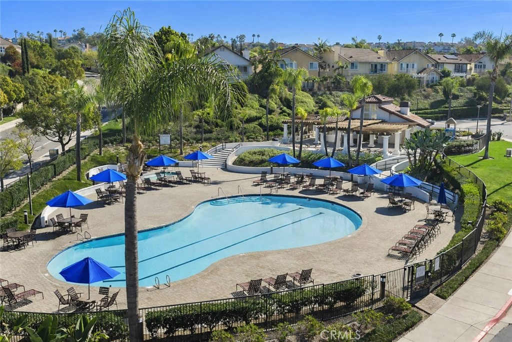 27871 Country Lane Road Laguna Niguel, CA 92677 - Photo 29 of 35 a view of swimming pool with outdoor seating and trees in the background
