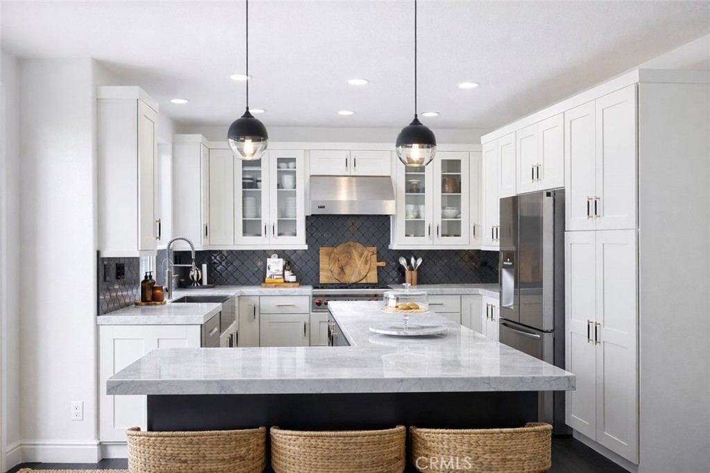 27871 Country Lane Road Laguna Niguel, CA 92677 - Photo 6 of 35 a kitchen with kitchen island a sink stainless steel appliances and cabinets