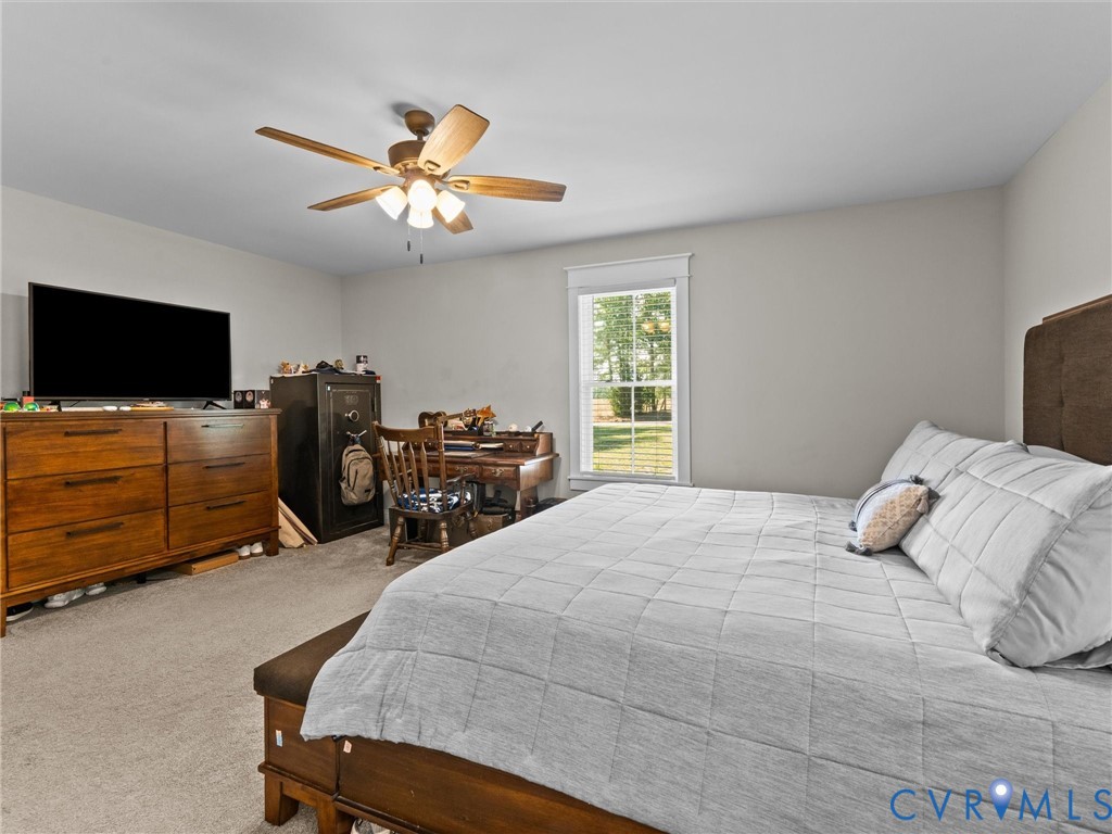 10819 Vaughan Road Petersburg, VA 23805 - Photo 17 of 45 Carpeted room featuring a ceiling fan with light f