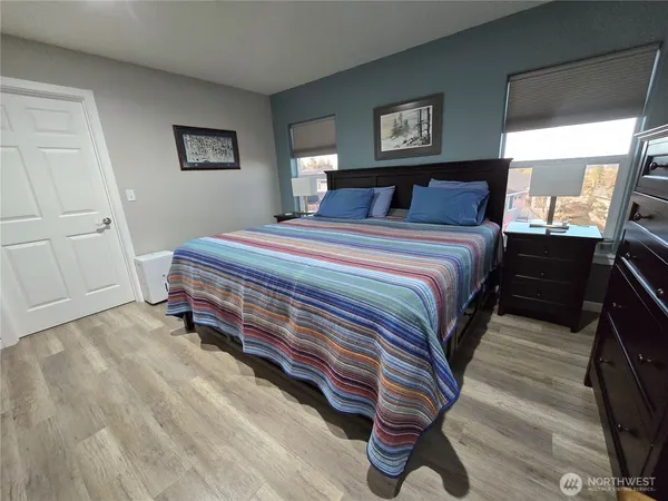a bedroom with a bed and a dresser