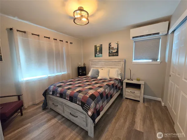 a bedroom with a bed and a table