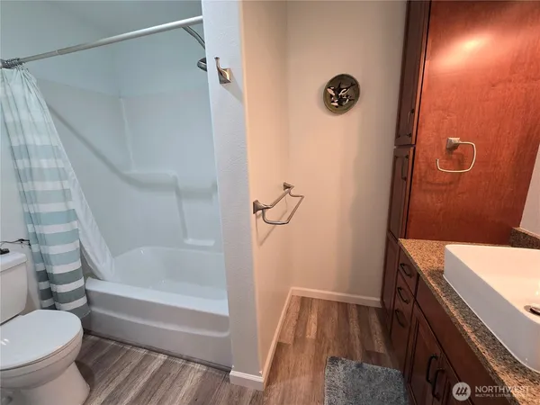 a bathroom with a bathtub and toilet
