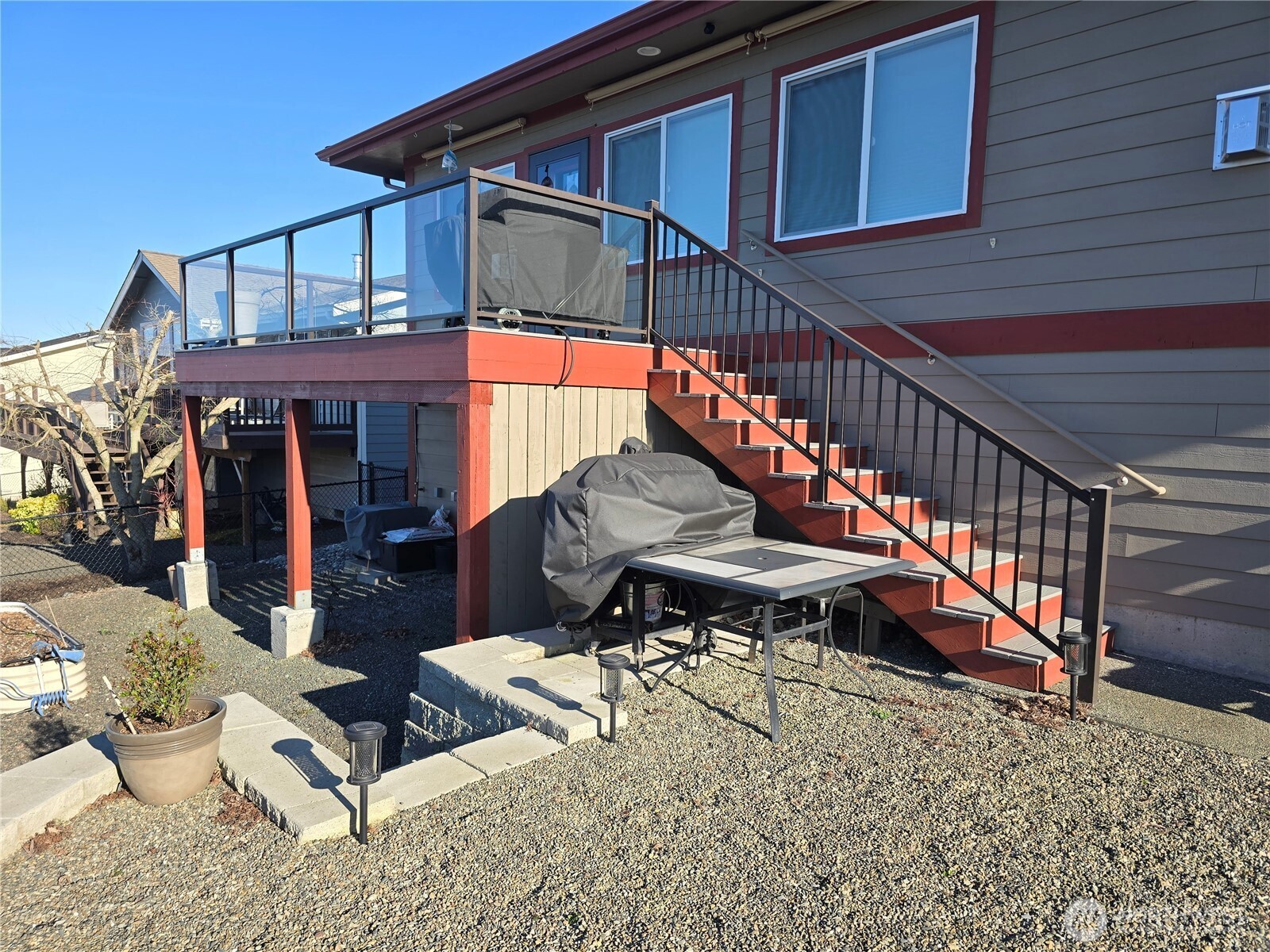 40 Topaz Way Sequim, WA 98382 - Photo 37 of 40 a backyard of a house with table and chairs