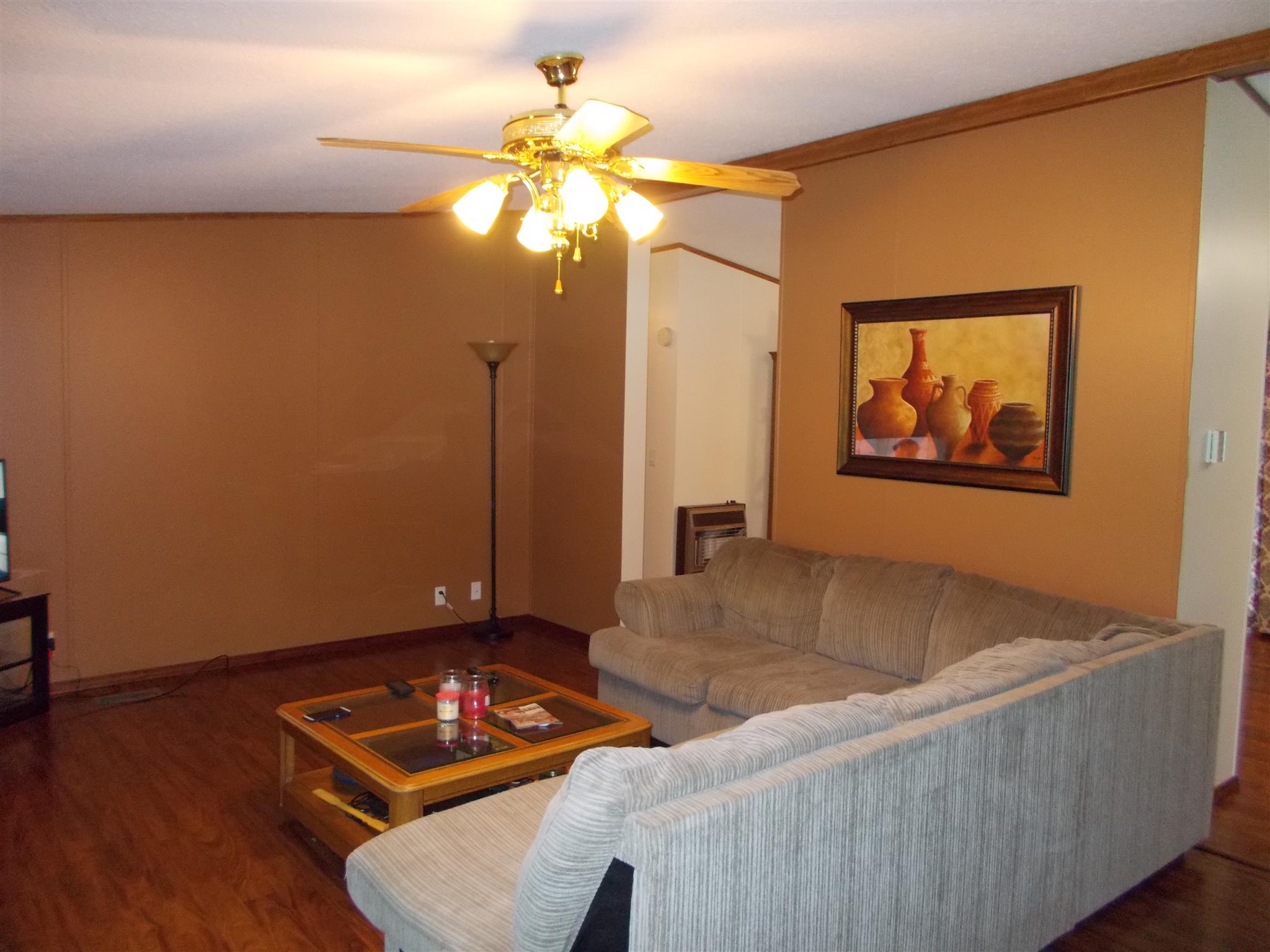 175 New Hope Road Five Points, TN 38457 - Photo 4 of 23 a living room with couches and a dining table with wooden floor