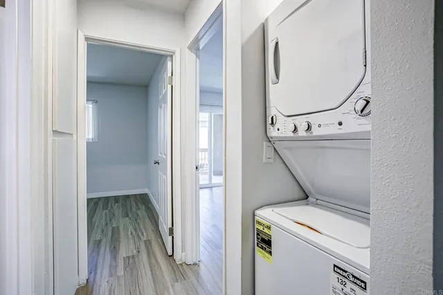 a view of washer and dryer with wooden floor