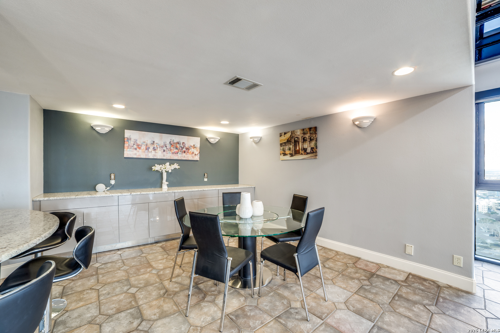7701 Wurzbach Road, Unit 2303 San Antonio, TX 78229 - Photo 11 of 32 a view of a dining room with furniture