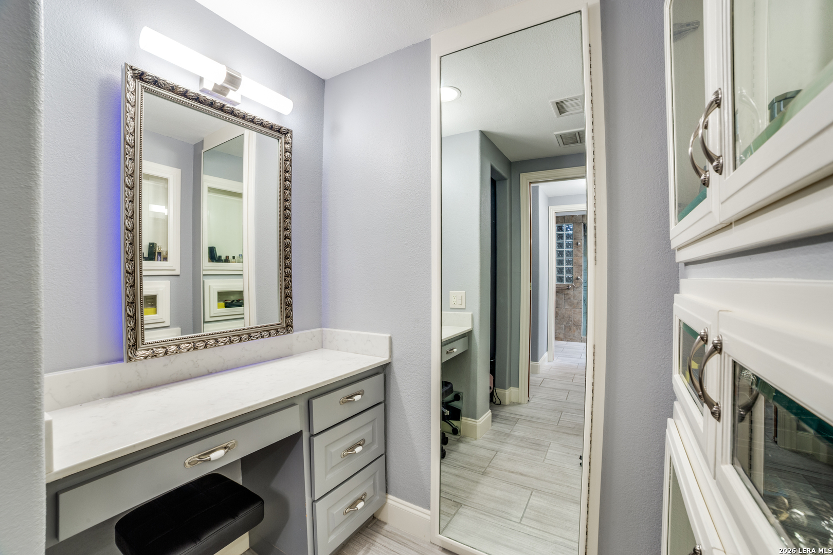 7701 Wurzbach Road, Unit 2303 San Antonio, TX 78229 - Photo 17 of 32 a bathroom with a sink and a mirror