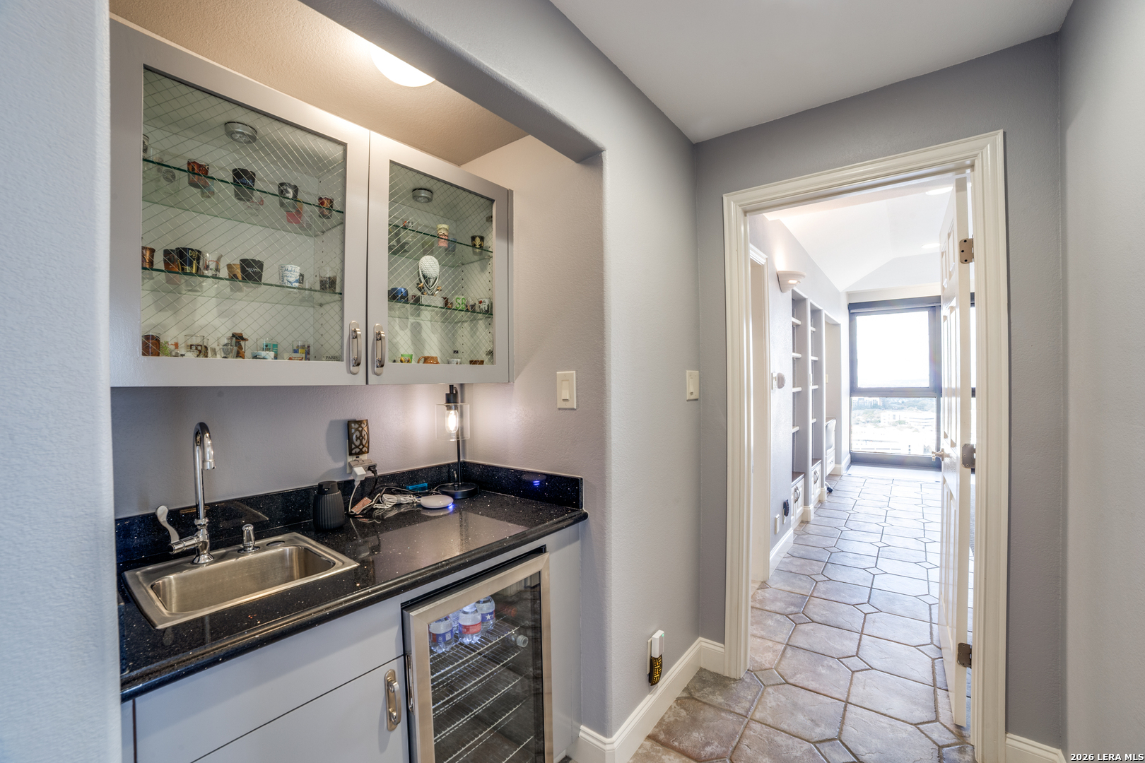7701 Wurzbach Road, Unit 2303 San Antonio, TX 78229 - Photo 18 of 32 a kitchen with a sink and cabinets