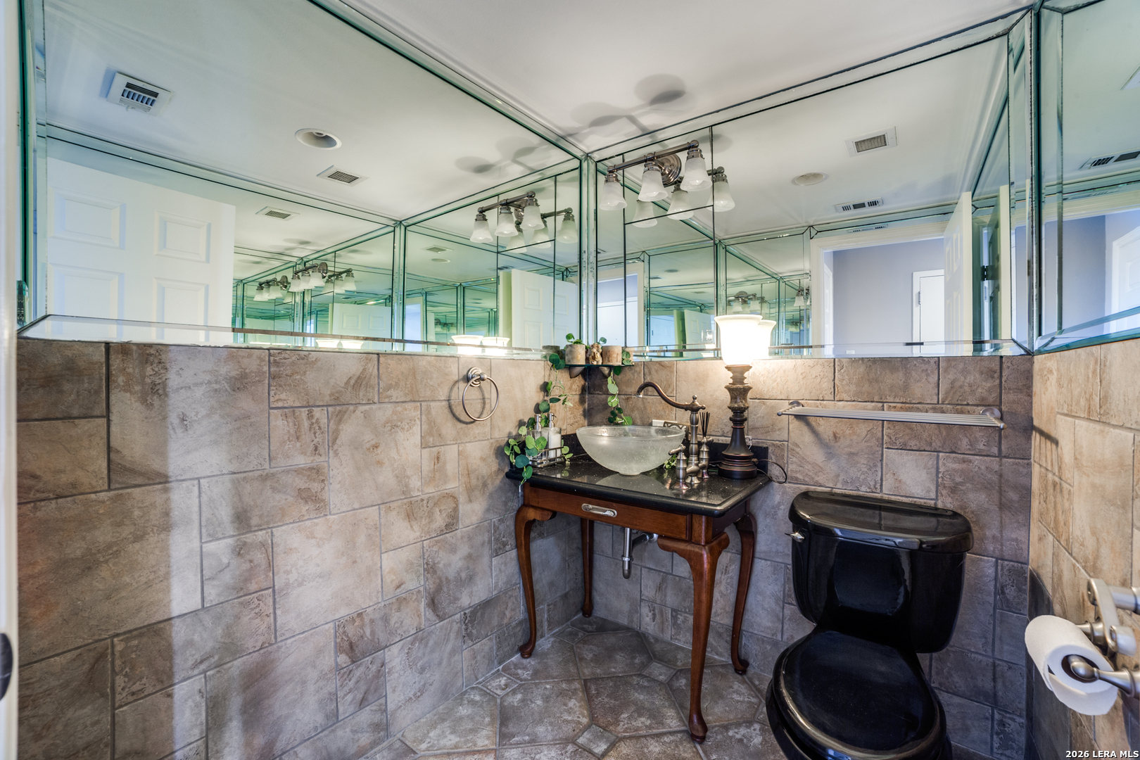 7701 Wurzbach Road, Unit 2303 San Antonio, TX 78229 - Photo 20 of 32 a bathroom with a sink toilet and a shower