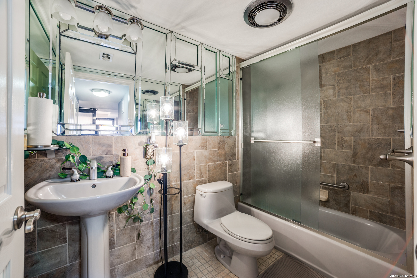 7701 Wurzbach Road, Unit 2303 San Antonio, TX 78229 - Photo 22 of 32 a bathroom with a sink toilet and shower