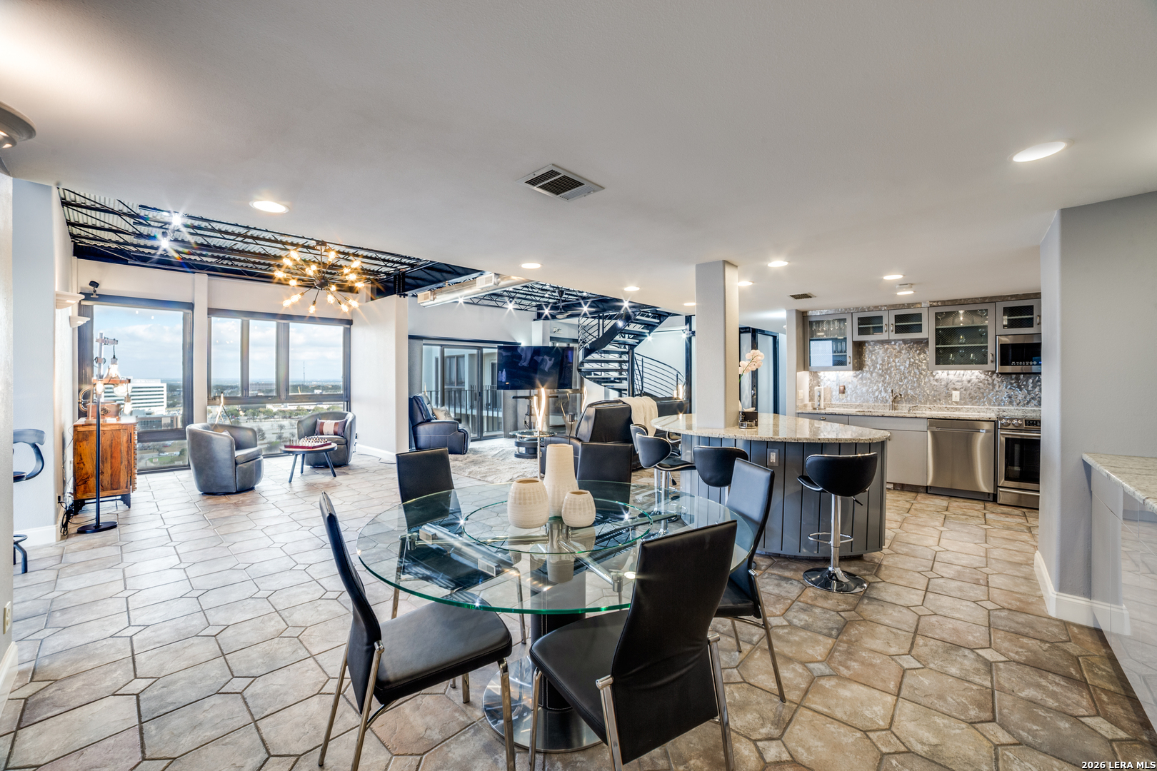7701 Wurzbach Road, Unit 2303 San Antonio, TX 78229 - Photo 5 of 32 a view of a dining area with furniture