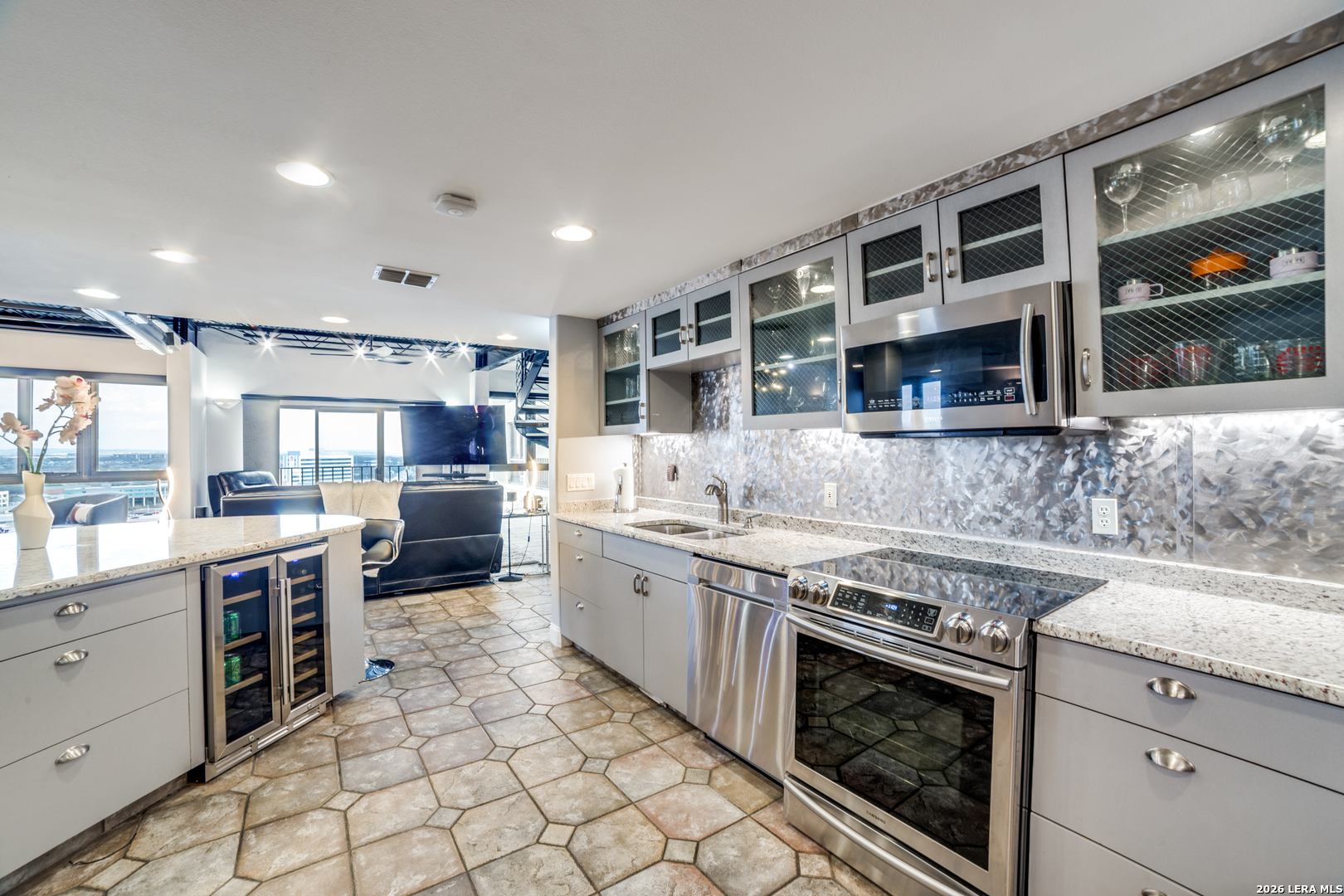 7701 Wurzbach Road, Unit 2303 San Antonio, TX 78229 - Photo 7 of 32 a kitchen with stainless steel appliances granite countertop a stove and a sink