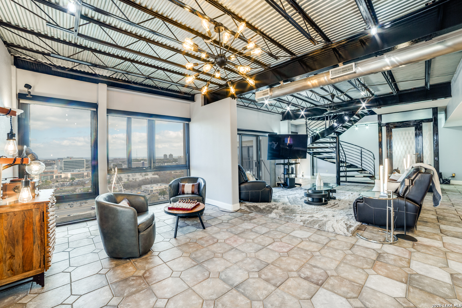 7701 Wurzbach Road, Unit 2303 San Antonio, TX 78229 - Photo 10 of 32 a living room with furniture and a potted plant