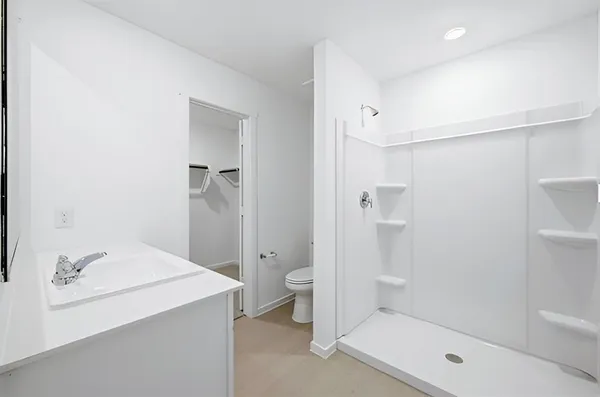 a bathroom with a shower and toilet