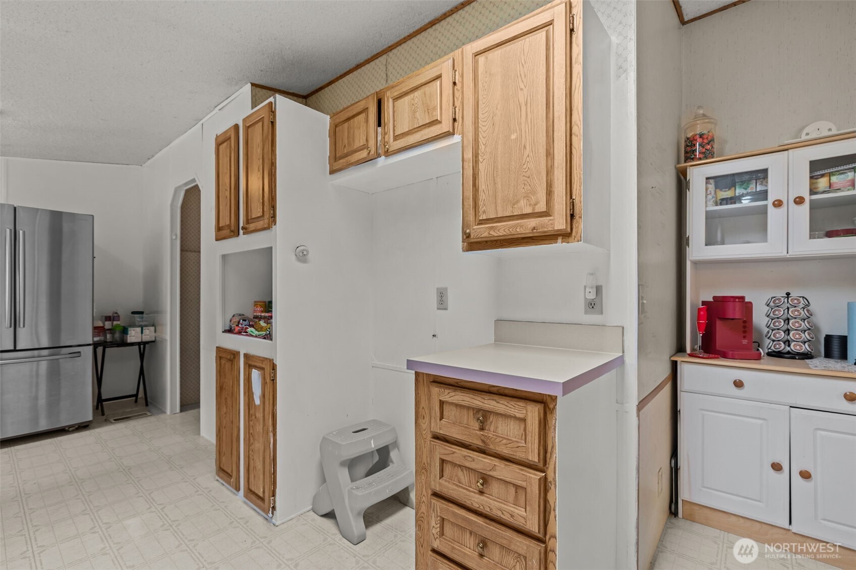 20750 113th Place Southeast Kent, WA 98031 - Photo 13 of 38 a kitchen with a refrigerator and cabinets