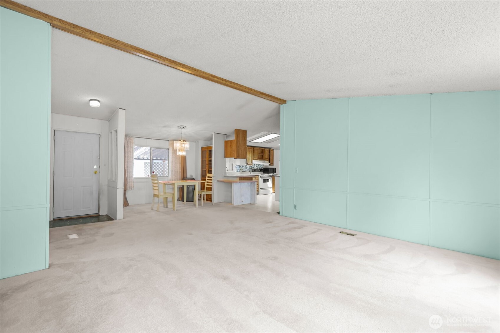 20750 113th Place Southeast Kent, WA 98031 - Photo 4 of 38 a view of a livingroom with furniture and kitchen view