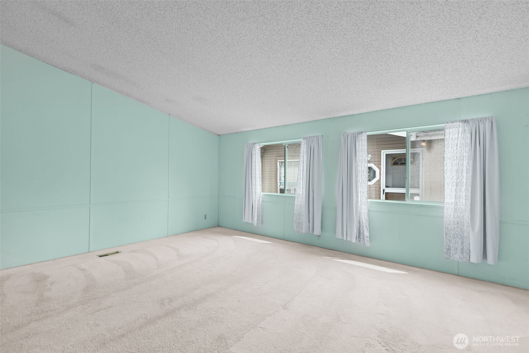 20750 113th Place Southeast Kent, WA 98031 - Photo 5 of 38 an empty room with closet and windows