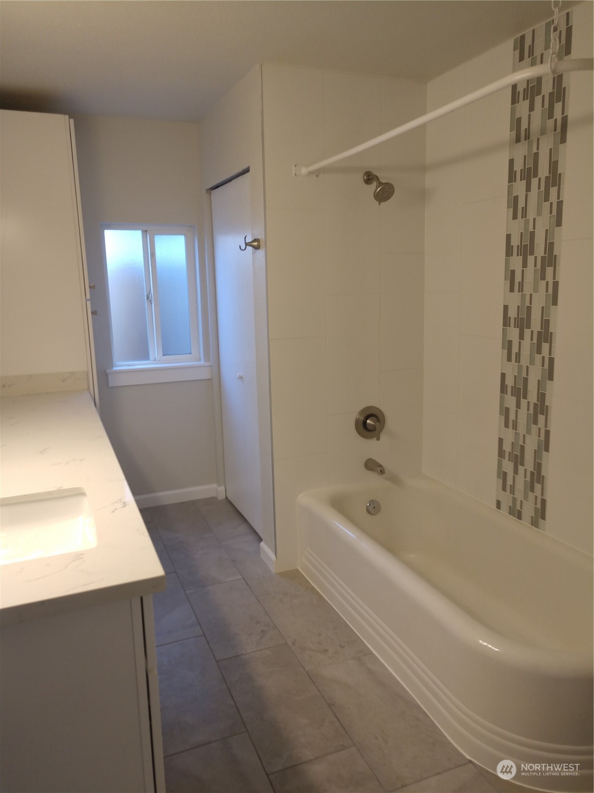 1902 Rockefeller Avenue Everett, WA 98201 - Photo 13 of 17 a bathroom with a bathtub a toilet and a shower