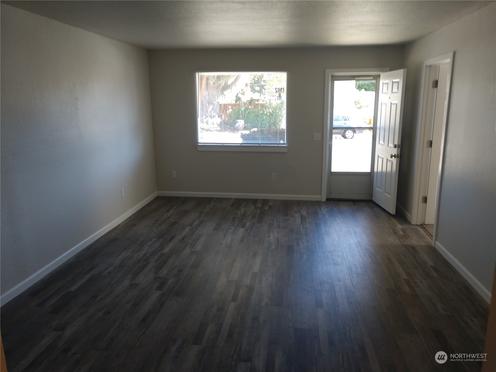 1902 Rockefeller Avenue Everett, WA 98201 - Photo 14 of 17 an empty room with wooden floor and windows
