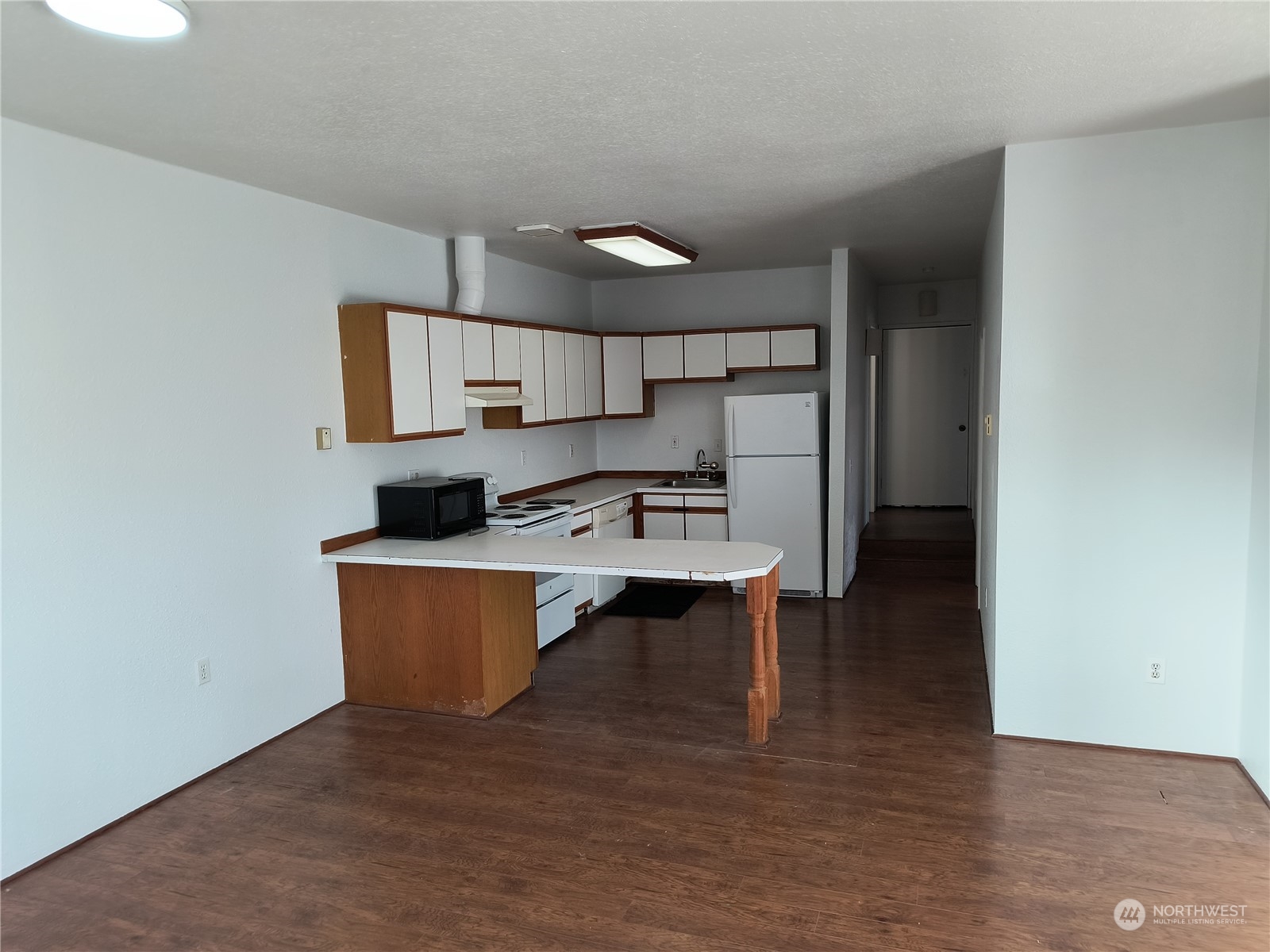 1902 Rockefeller Avenue Everett, WA 98201 - Photo 9 of 17 a living room with stainless steel appliances a sink cabinets and wooden floor