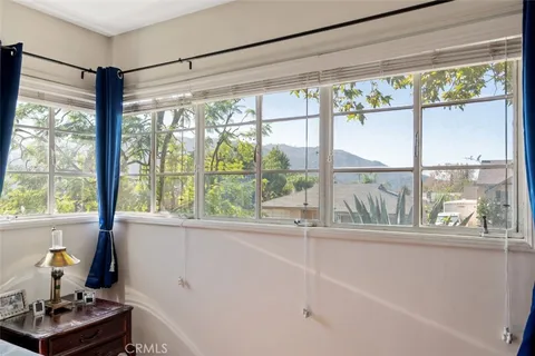 a living room with large windows