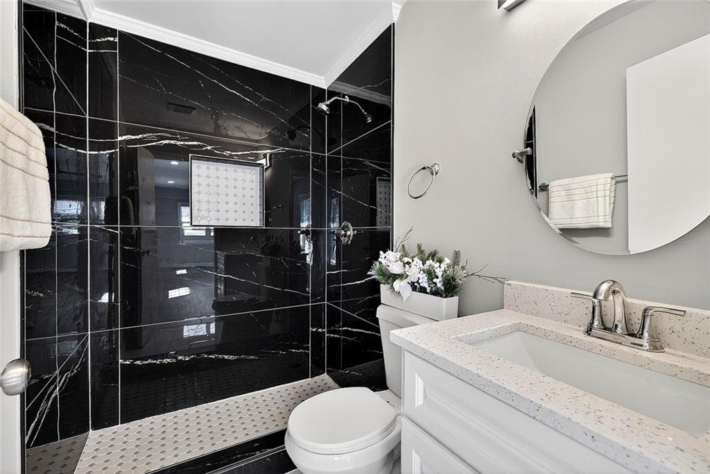 3045 Lindon Lane Decatur, GA 30033 - Photo 12 of 18 a bathroom with a sink a toilet and shower