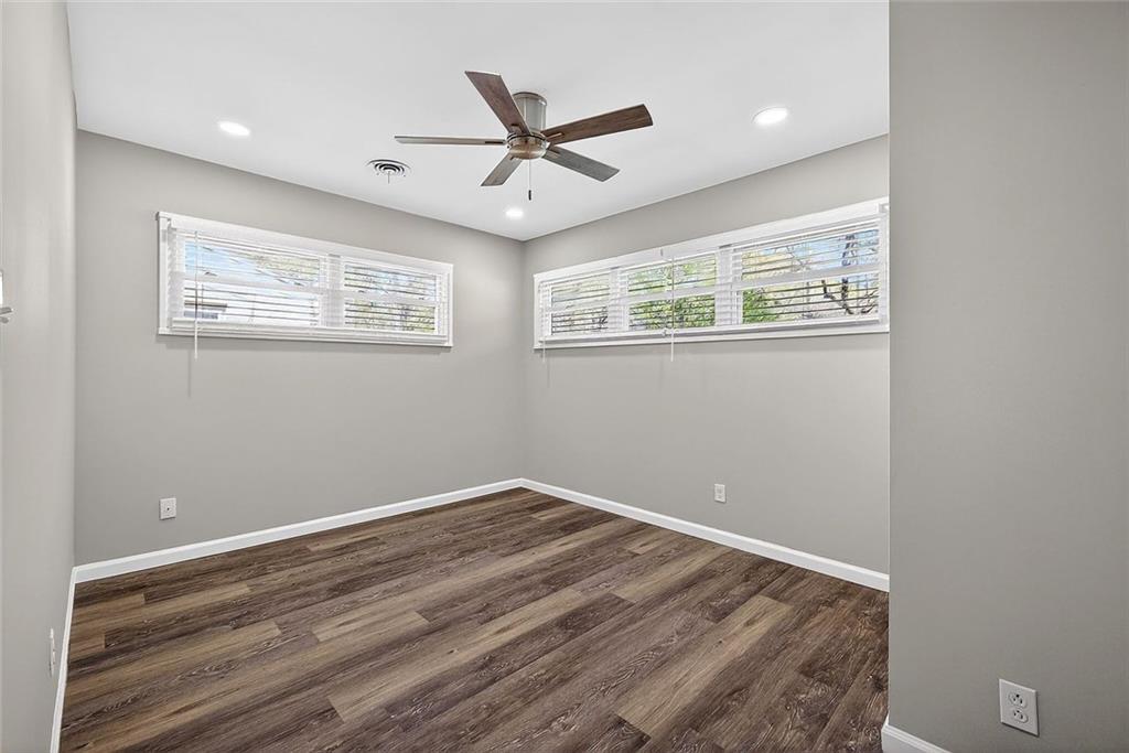 3045 Lindon Lane Decatur, GA 30033 - Photo 14 of 18 a view of a big room with wooden floor and a ceiling fan