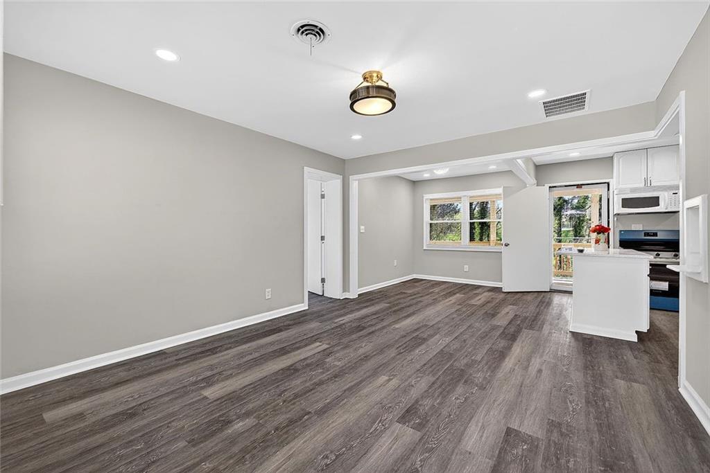 3045 Lindon Lane Decatur, GA 30033 - Photo 4 of 18 a view of livingroom with hardwood floor and kitchen view
